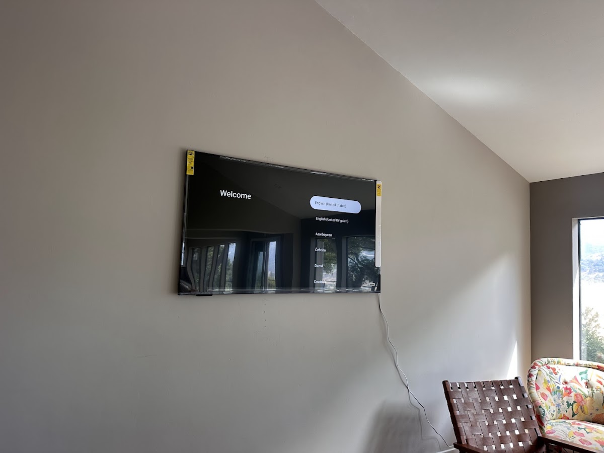 Television mounted on a living room wall